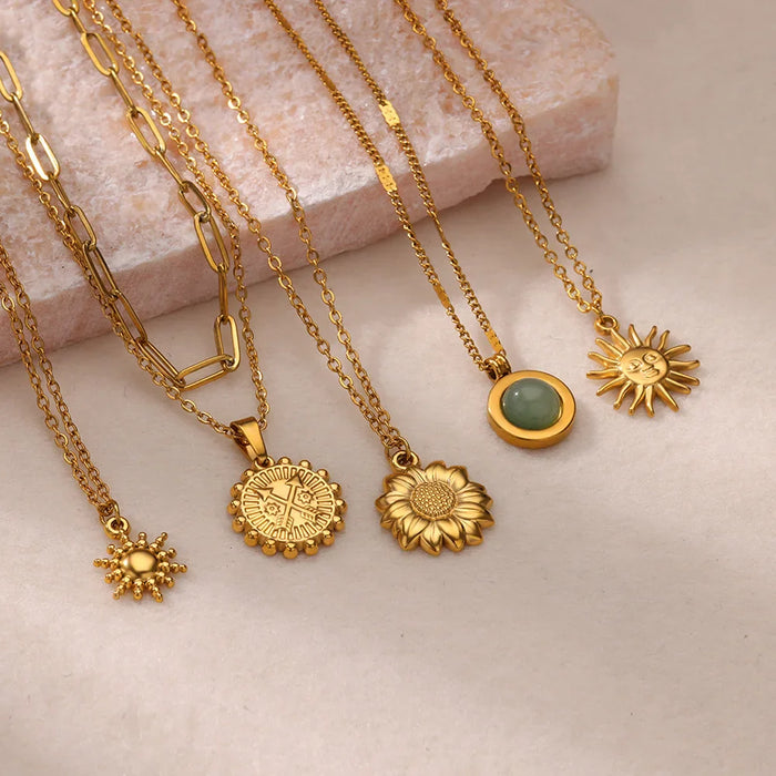 Elegant gold necklace with various pendants