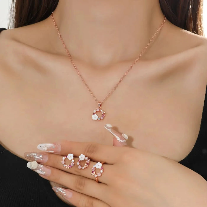 Schmuckset in Roségoldfarbe, dreiteilig, mit Blüten-Motiv